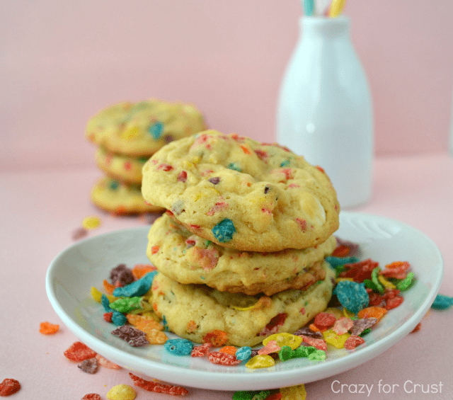 stack of fruity pebbles cookies on a light blue plate