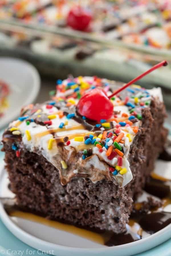 Ice Cream Poke Cake - an easy poke cake filled with melted ice cream! The perfect potluck recipe for summer.