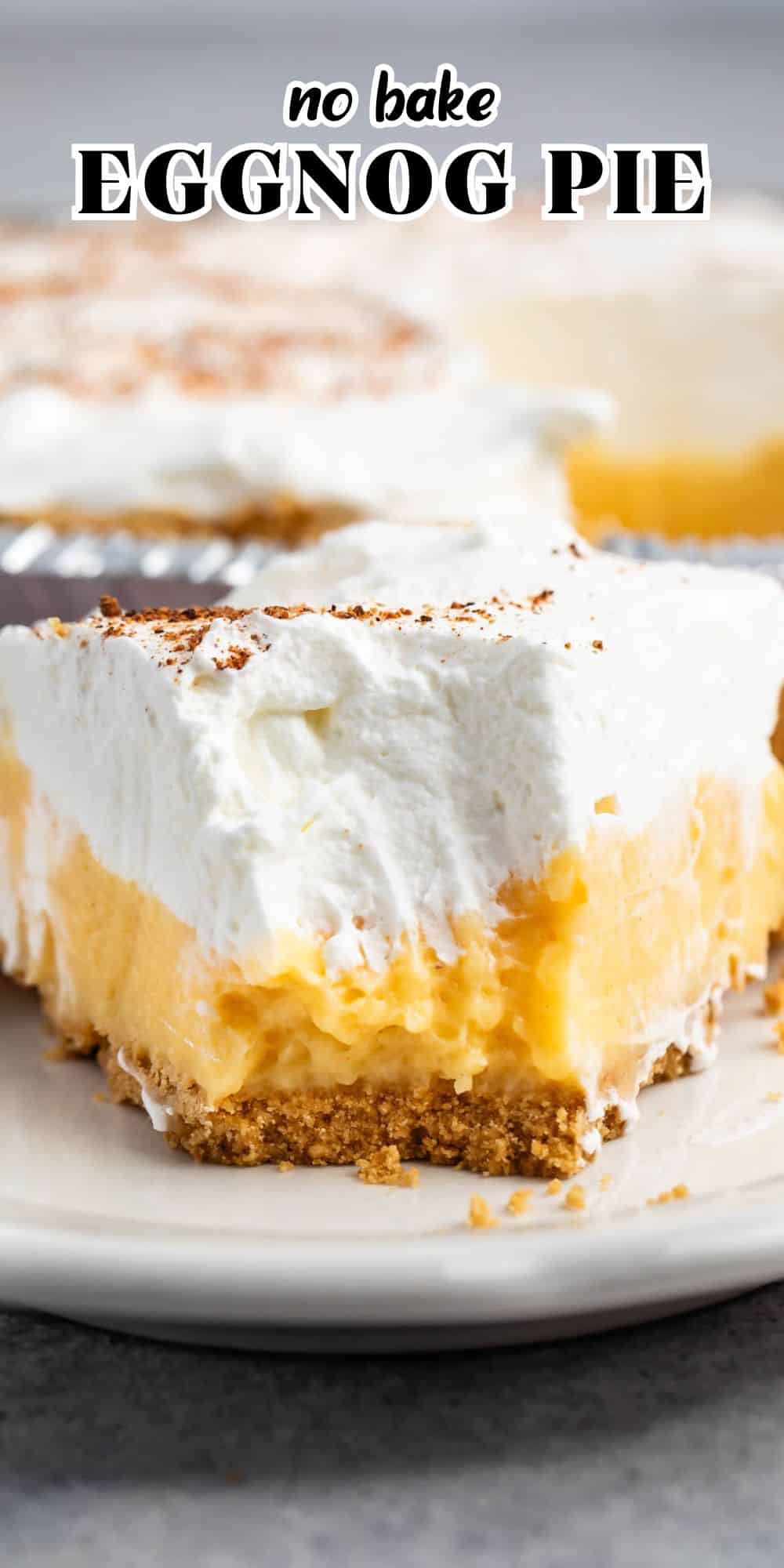 A slice of no-bake eggnog pie graces a plate, boasting a crumbly crust, creamy yellow filling, and a generous layer of whipped cream dusted with nutmeg. Other tempting slices of the eggnog delight are visible in the background.