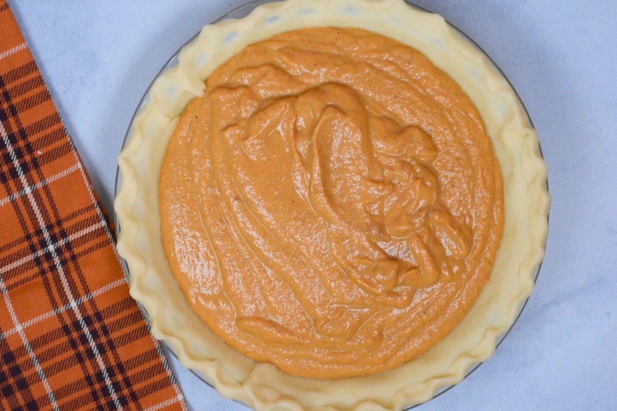 pumpkin mixture in pie crust