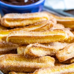 stack of churros on tray.