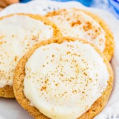 Eggnog snickerdoodles with eggnog frosting on a plate