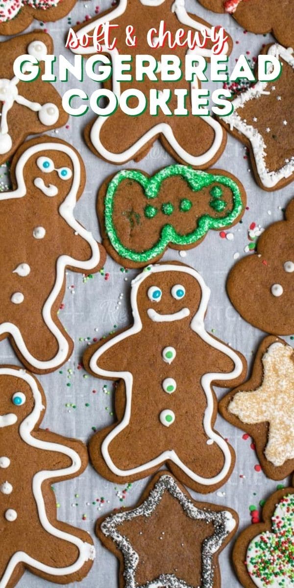 overhead shot of gingerbread men on parchment with words on photo