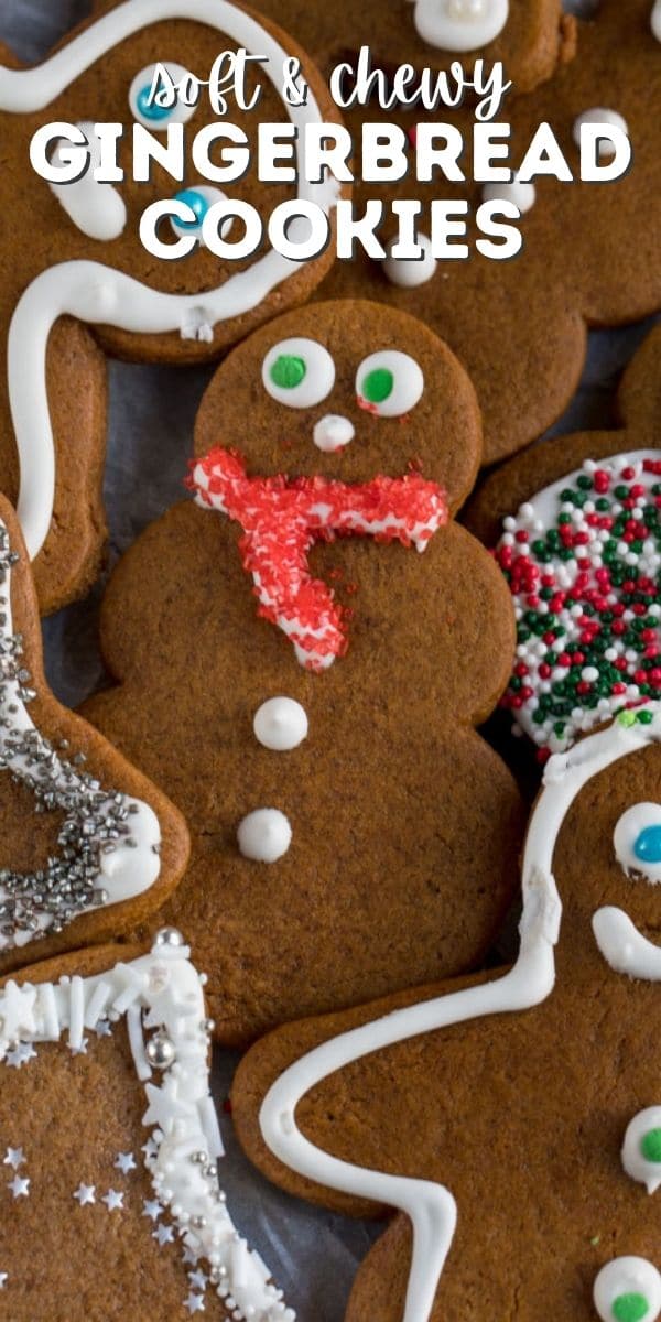 overhead shot of gingerbread snowman on parchment with words on photo