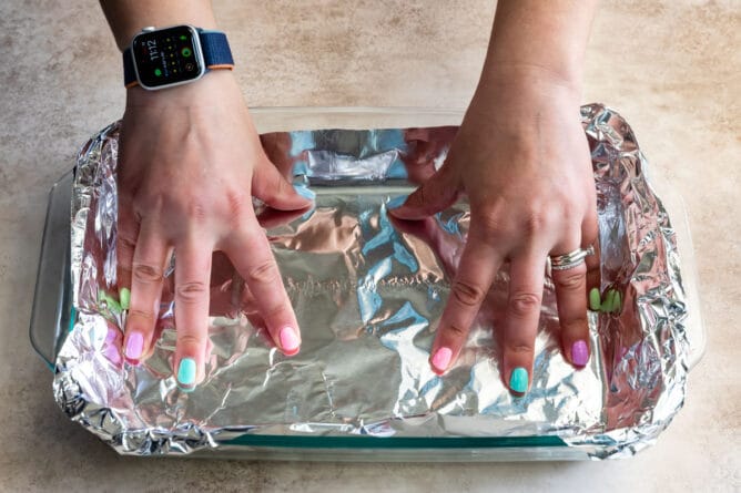 https://www.crazyforcrust.com/wp-content/uploads/2021/04/how-to-line-a-pan-with-foil-1-668x445.jpg