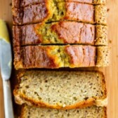 Overhead view of loaf of banana bread cut into slices