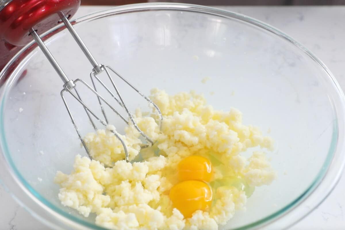 creamed butter and sugar with egg in a large clear bowl with mixer.