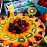 fruit tart with butter behind