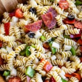 Overhead shot of easy italian pasta salad in a wooden bowl