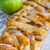 Overhead view of easy apple strudel with apple in background