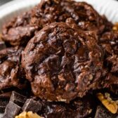 Close up shot of plate full of flourless brownie cookies