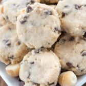 A bunch of macadamia chocolate chip shortbread cookies on a plate