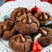 stack of blossom cookies on white plate