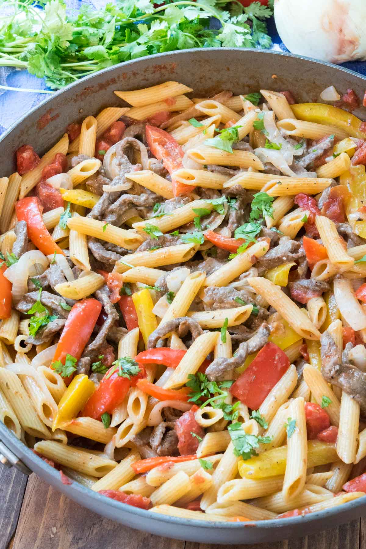 Steak fajita pasta in a deep dish skillet