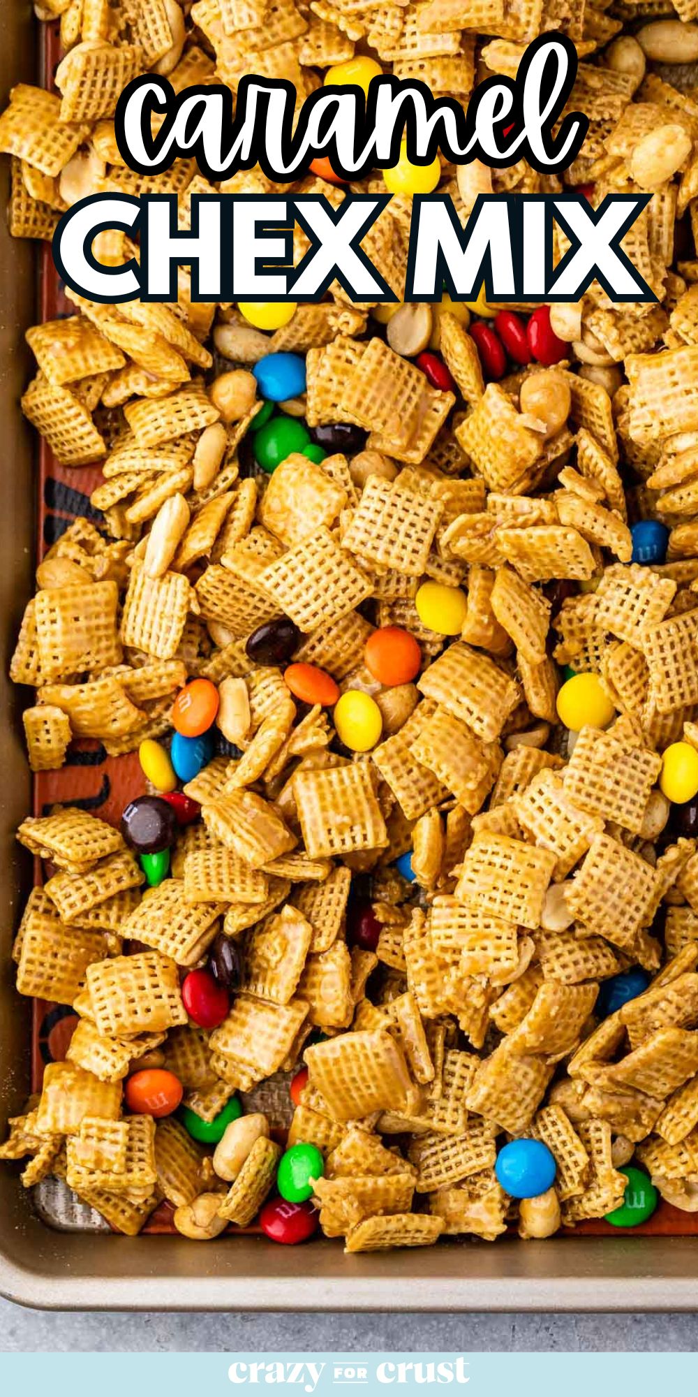 Sheet pan of Chex mix with M&Ms and words on photo.