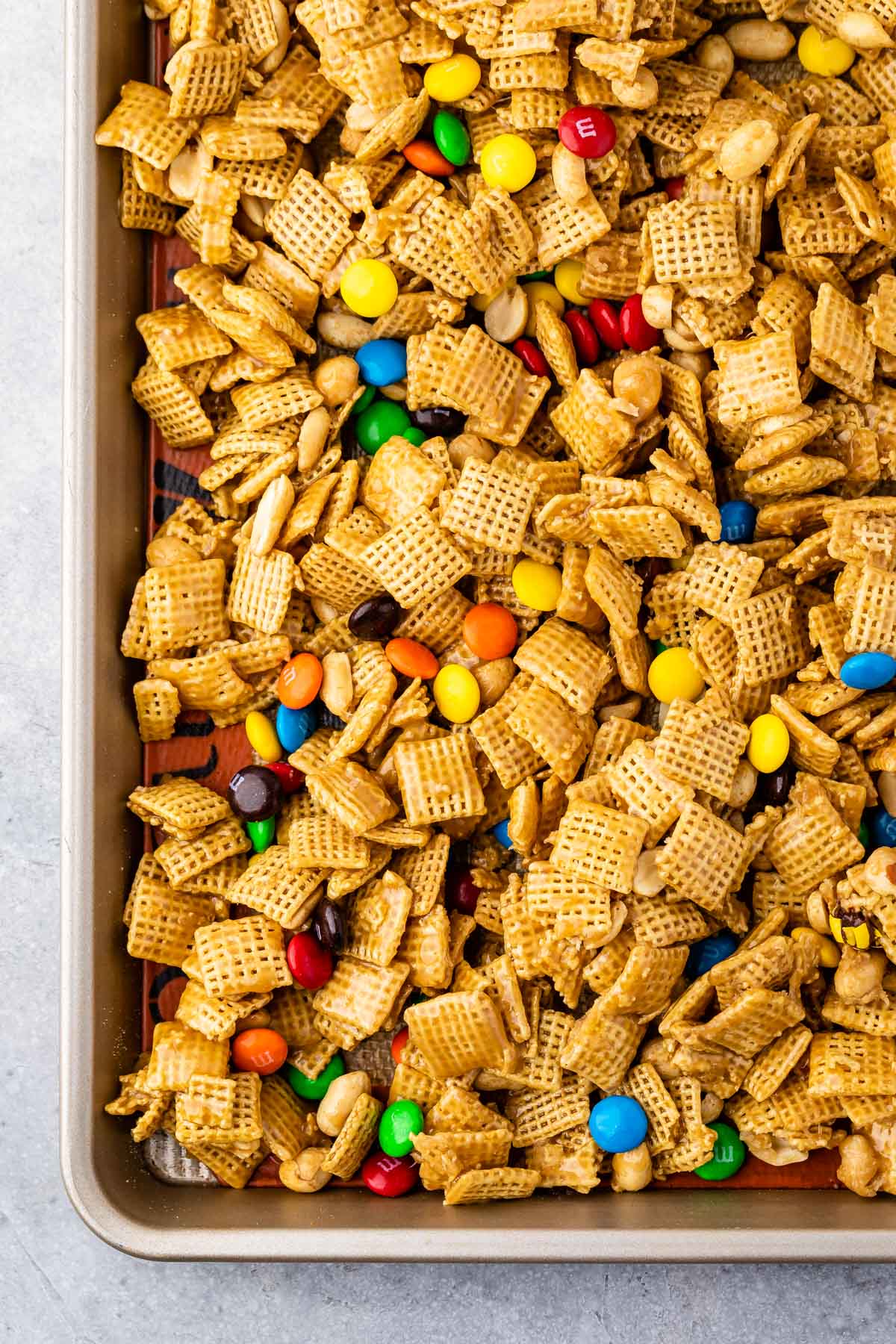 Sheet pan of Chex mix with M&Ms.