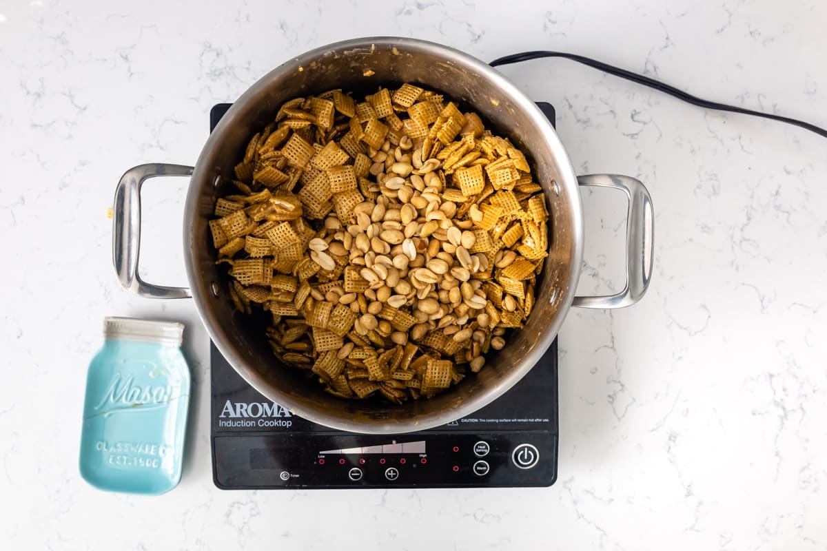 pan on hot plate with Chex and nuts inside.