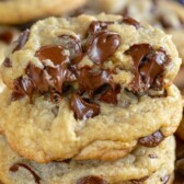 stack of 4 chocolate chip cookies with one cut in half