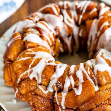 monkey bread with glaze on white plate