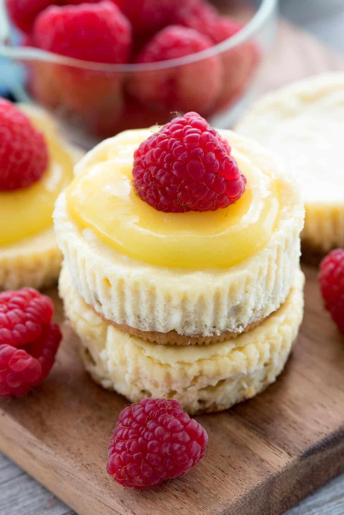 mini cheesecake with lemon curd and a raspberry on top
