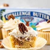 cupcake cut in half in front of butter box