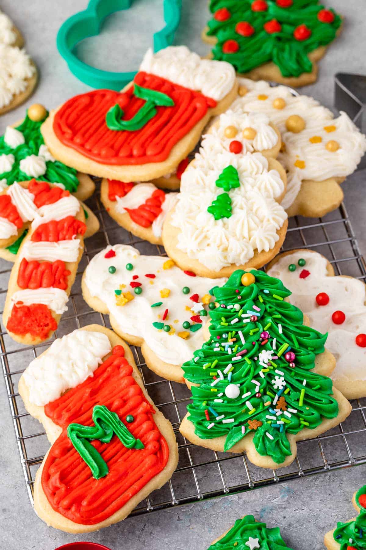 christmas shaped cookies with frosting decorating the cookies