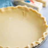 butter pie crust in a clear pan.