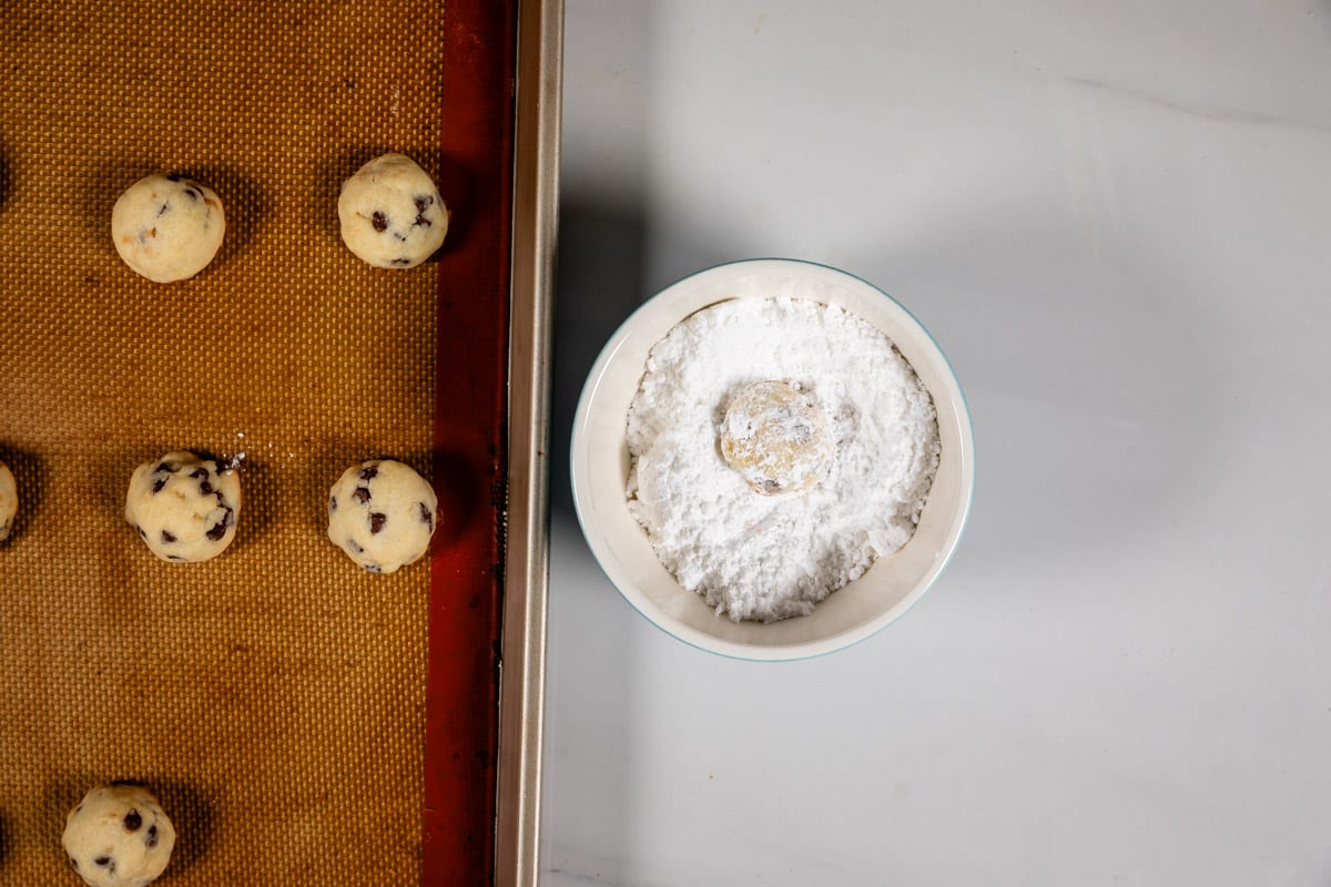 process shot of chocolate chip snowball cookies.