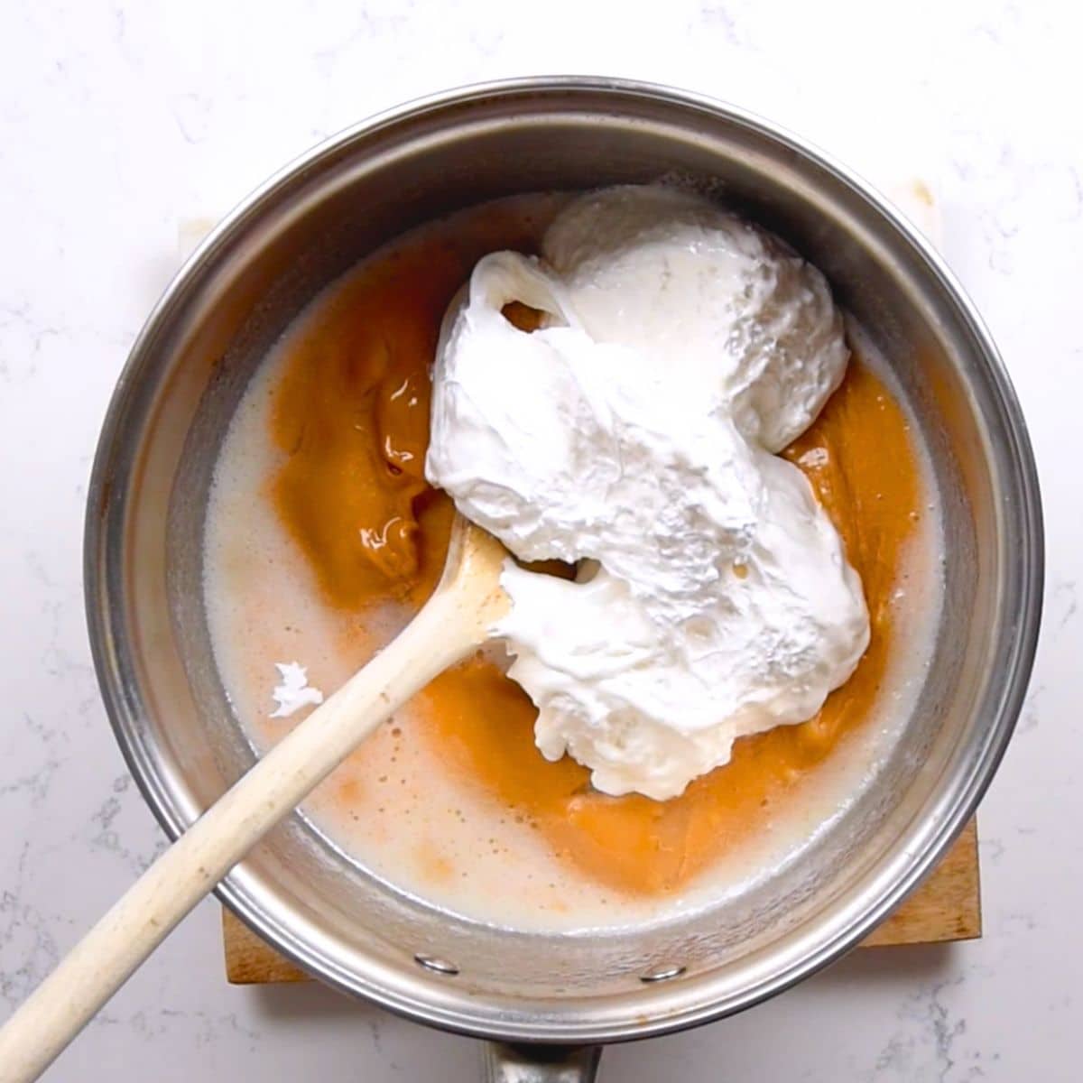 saucepan on hot plate with peanut butter and fluff.