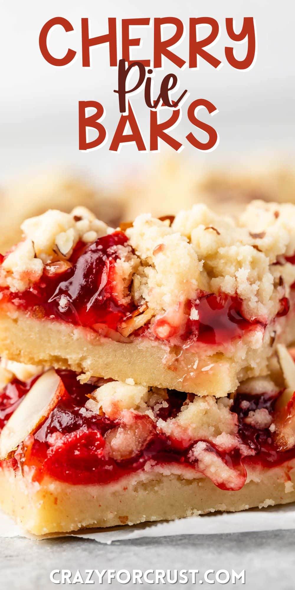 pie crust bars with red cherry pie filling and sliced almonds on top with words on the image.