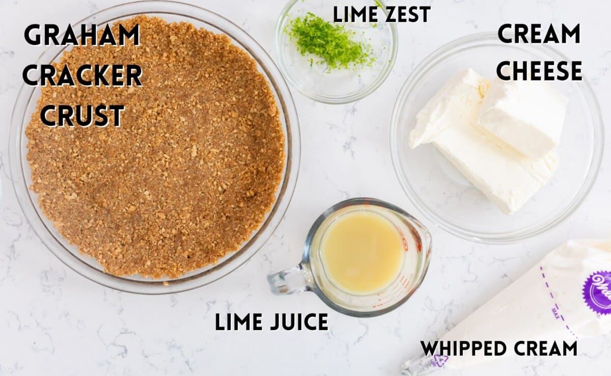 ingredients in key lime pie laid out on a white counter. 