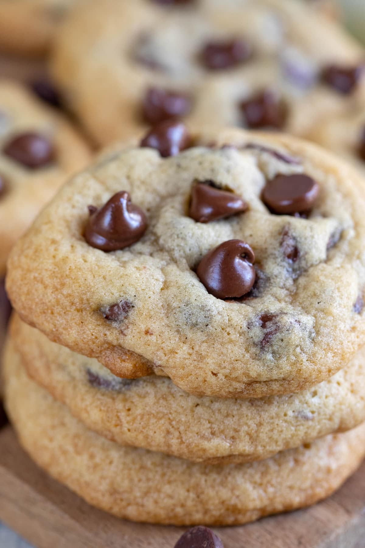 stacked chocolate chip cookies with melted chocolate chips baked in.
