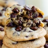 stacked chocolate chip cookies with melted chocolate chips baked in.