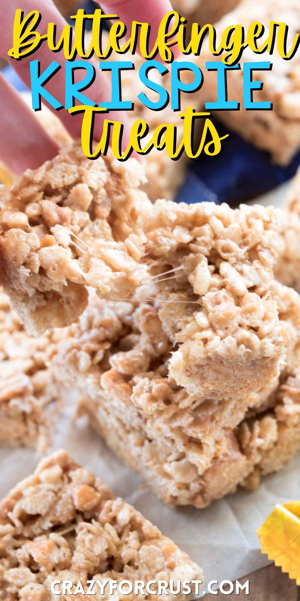 stacked Rice Krispie treats with butterfingers spread around with words on the image.