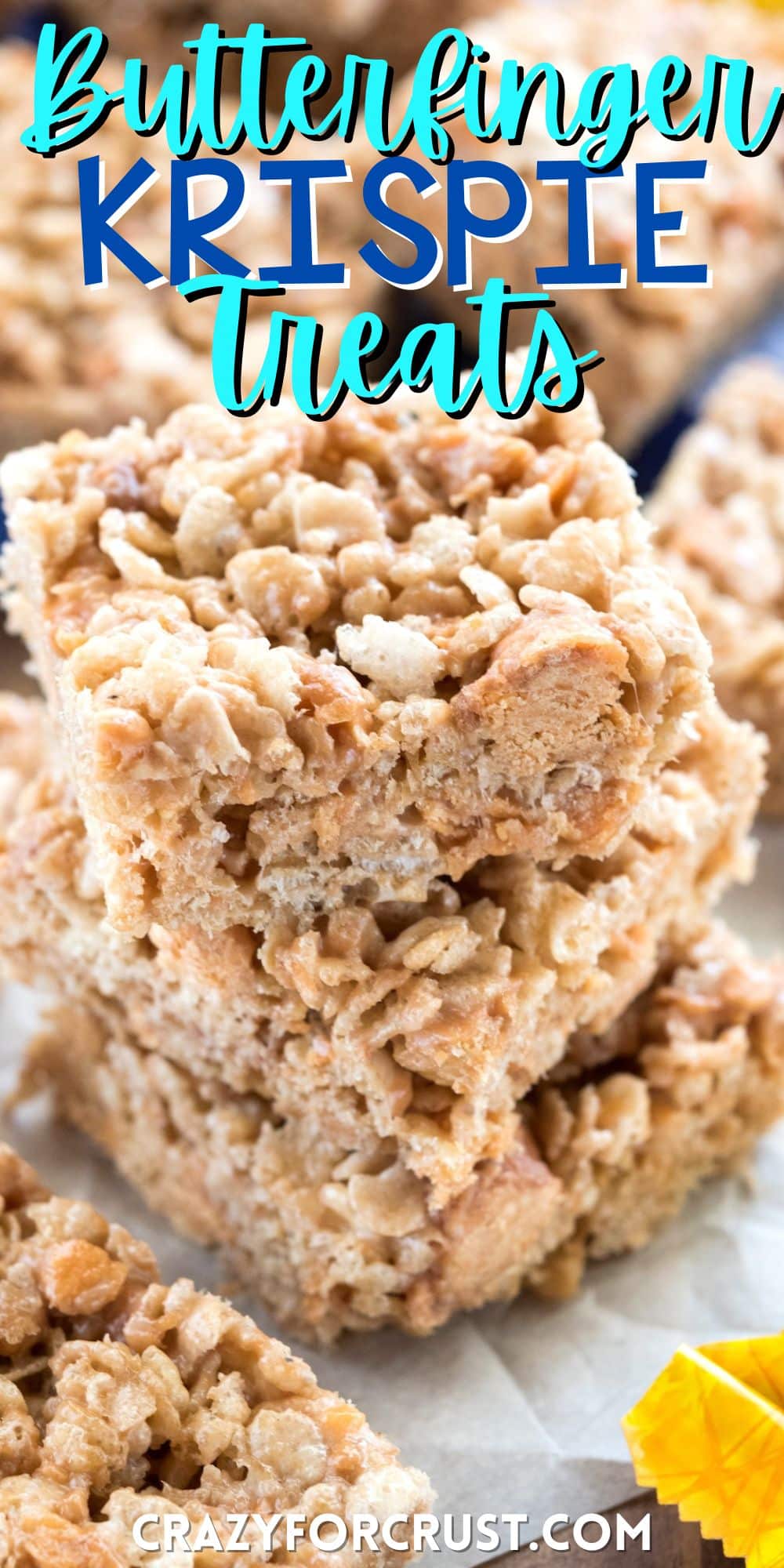 stacked Rice Krispie treats with butterfingers spread around with words on the image.