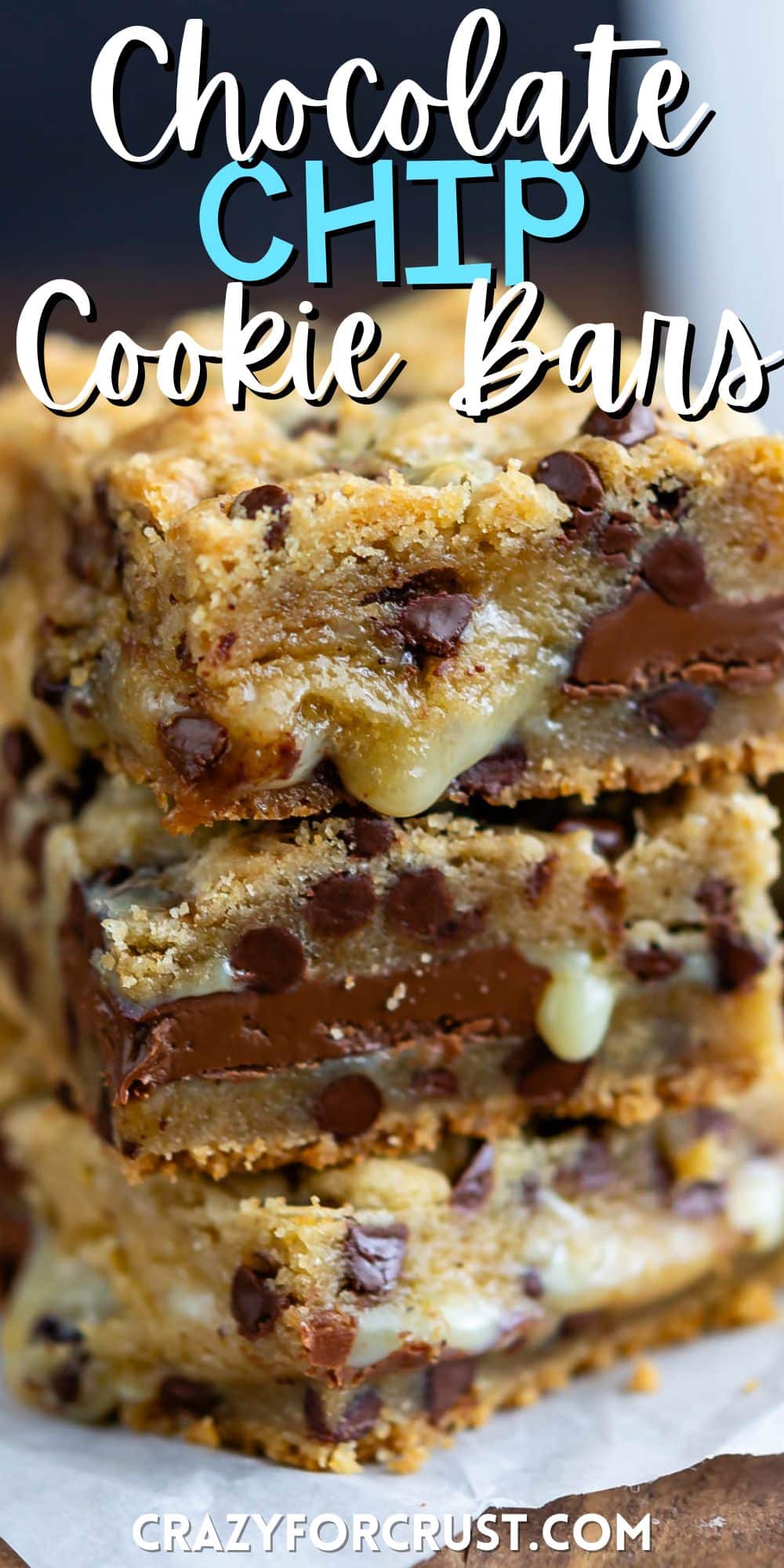 stacked gooey bars with chocolate chips baked into the center with words on the image.