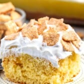 cake with white frosting and cinnamon toast crunch on top.