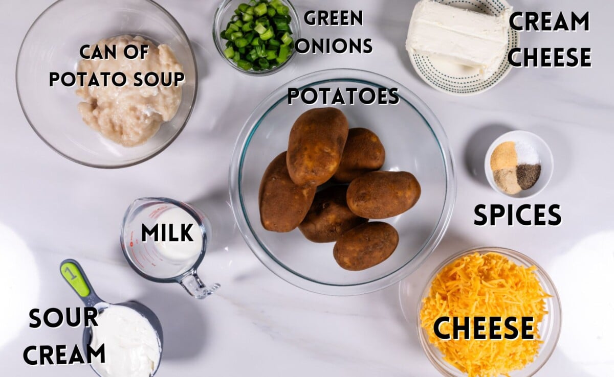 ingredients in cheesy potatoes laid out on a marble counter.