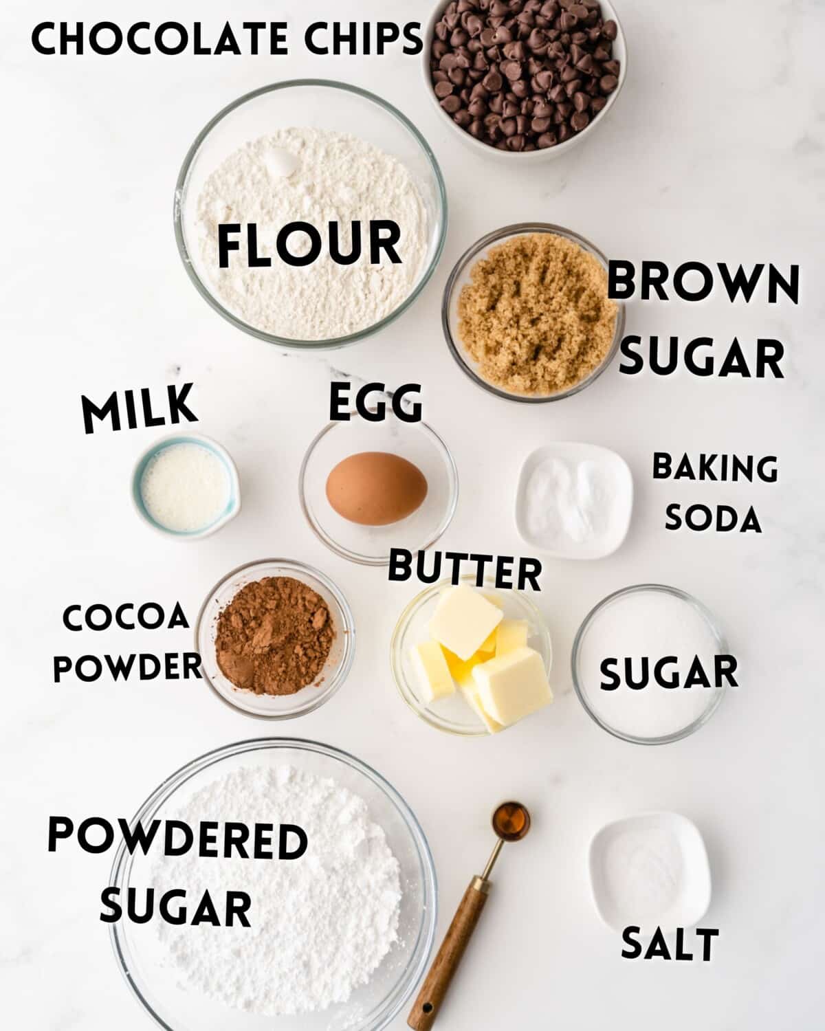 ingredients in cookie cake laid out on a white marble counter.