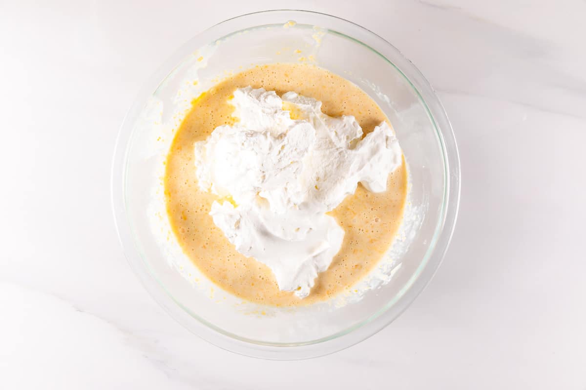 process shot of peach ice cream being made.