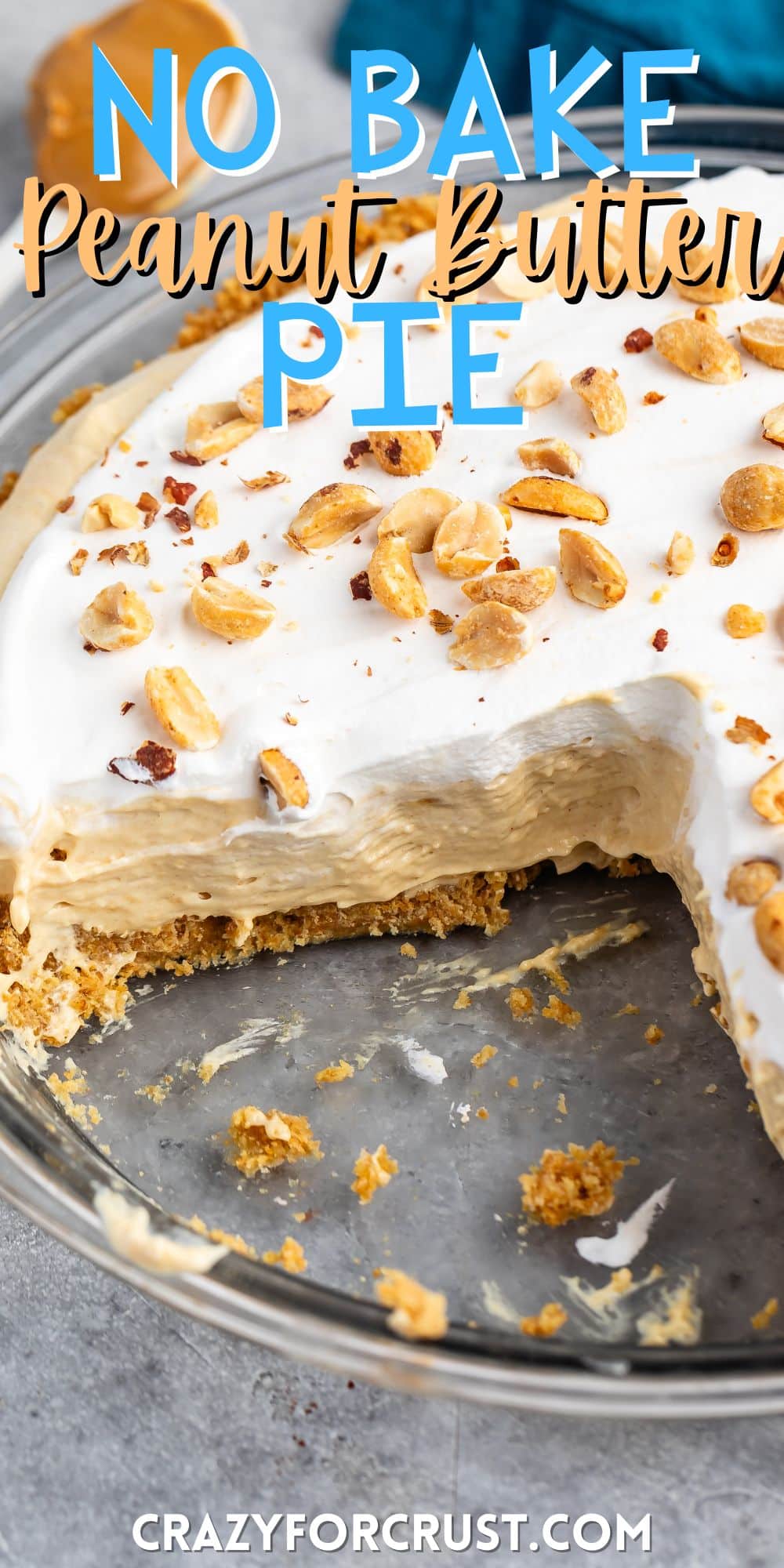 peanut butter pie in a glass pie plate with peanuts on top with words on the image.