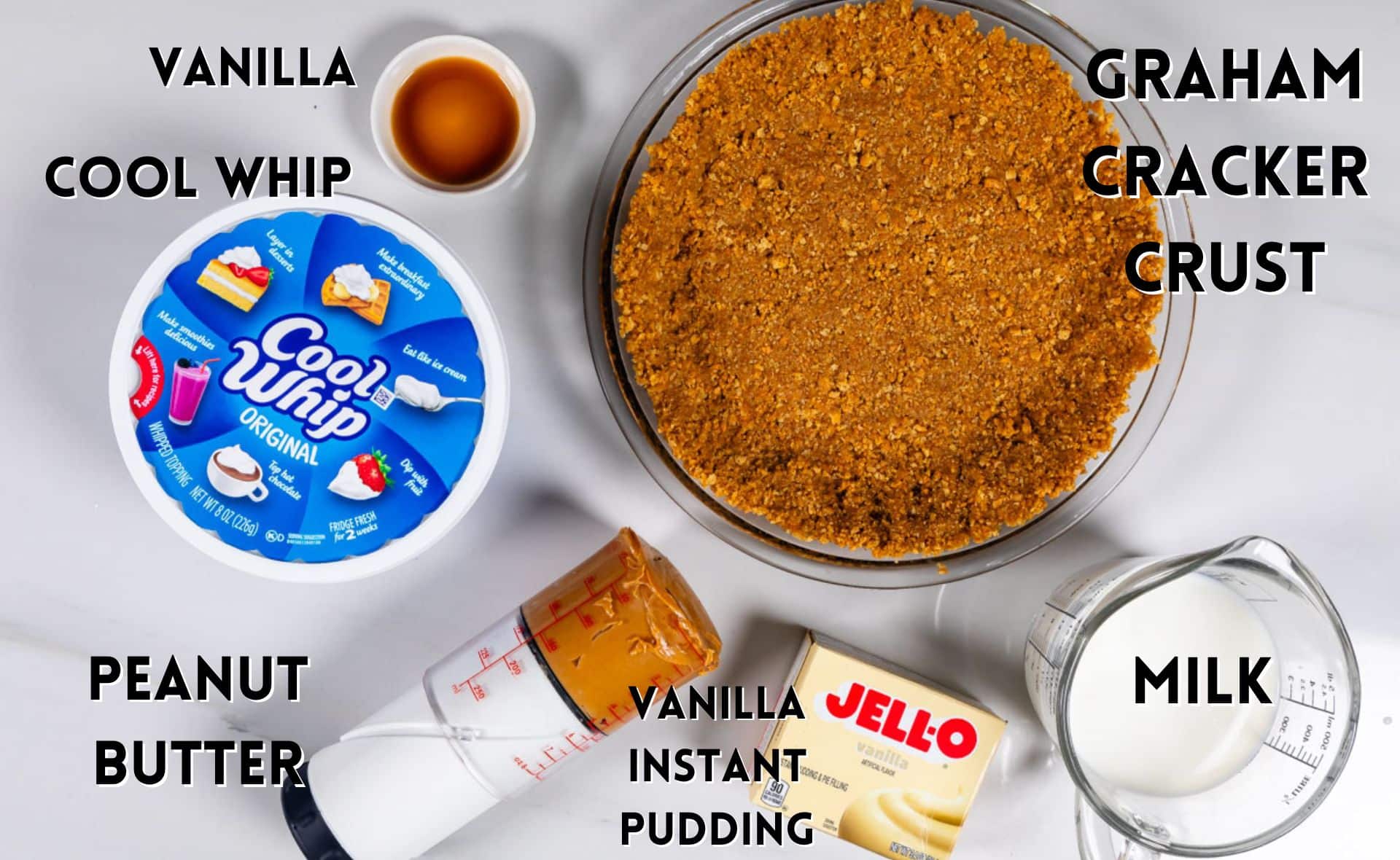 Ingredients in no bake peanut butter pie laid out on a white counter.