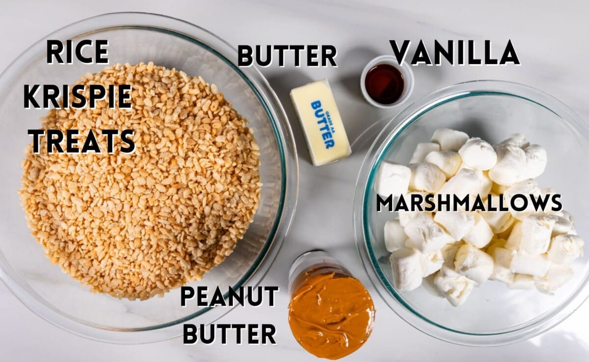 ingredients in peanut butter Rice Krispie treats laid out on a white marble counter.