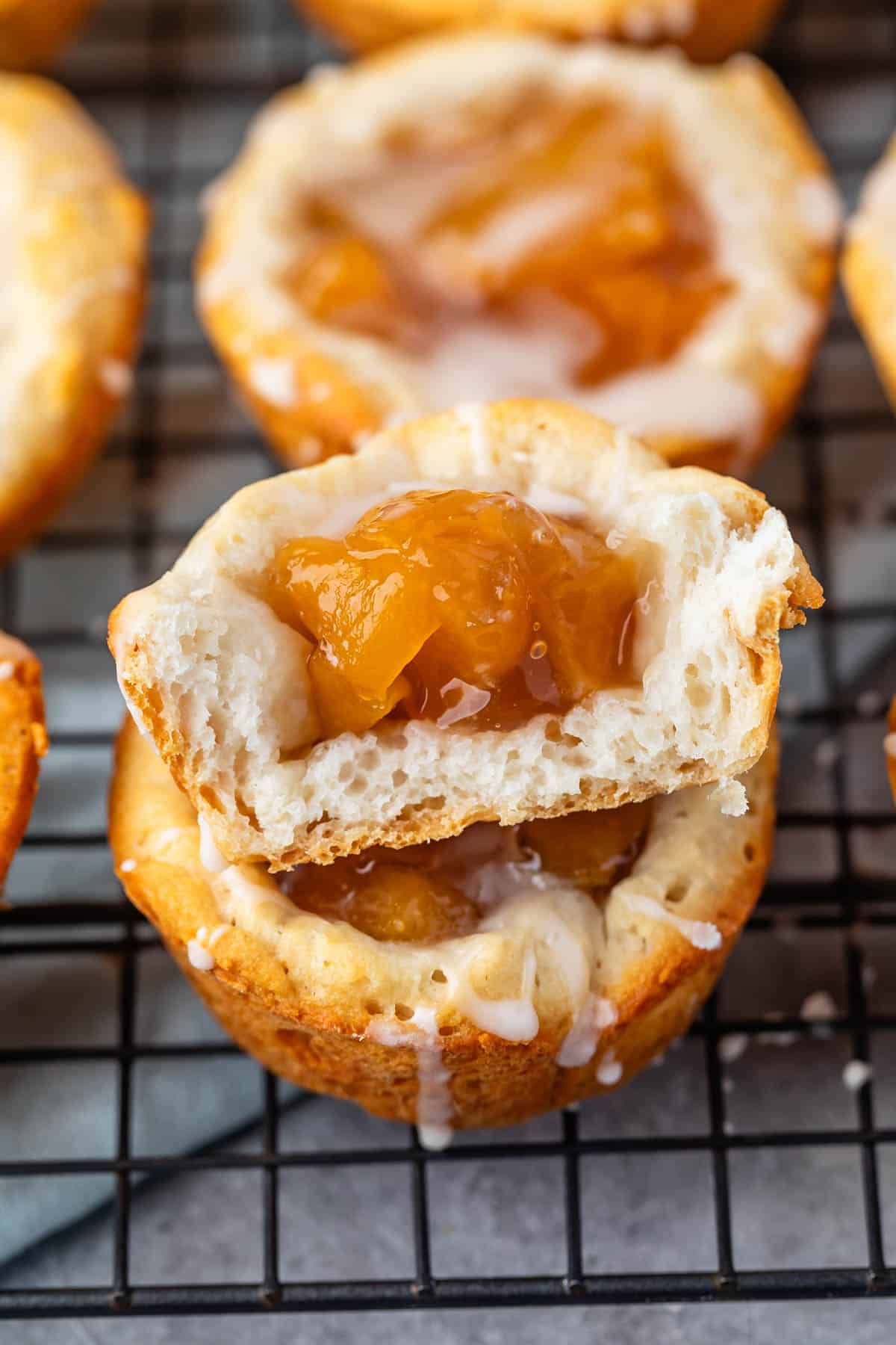 small stacked danishes with peaches baked into the center.