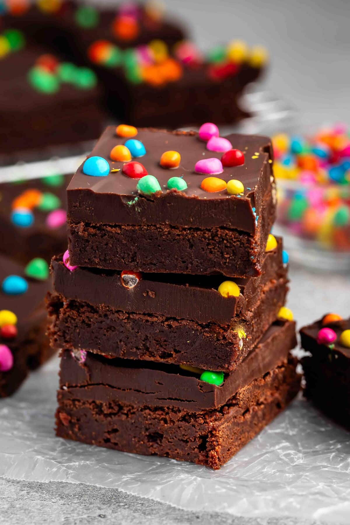 stacked chocolate brownies with colorful chocolate candy baked in.