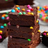 stacked chocolate brownies with colorful chocolate candy baked in.