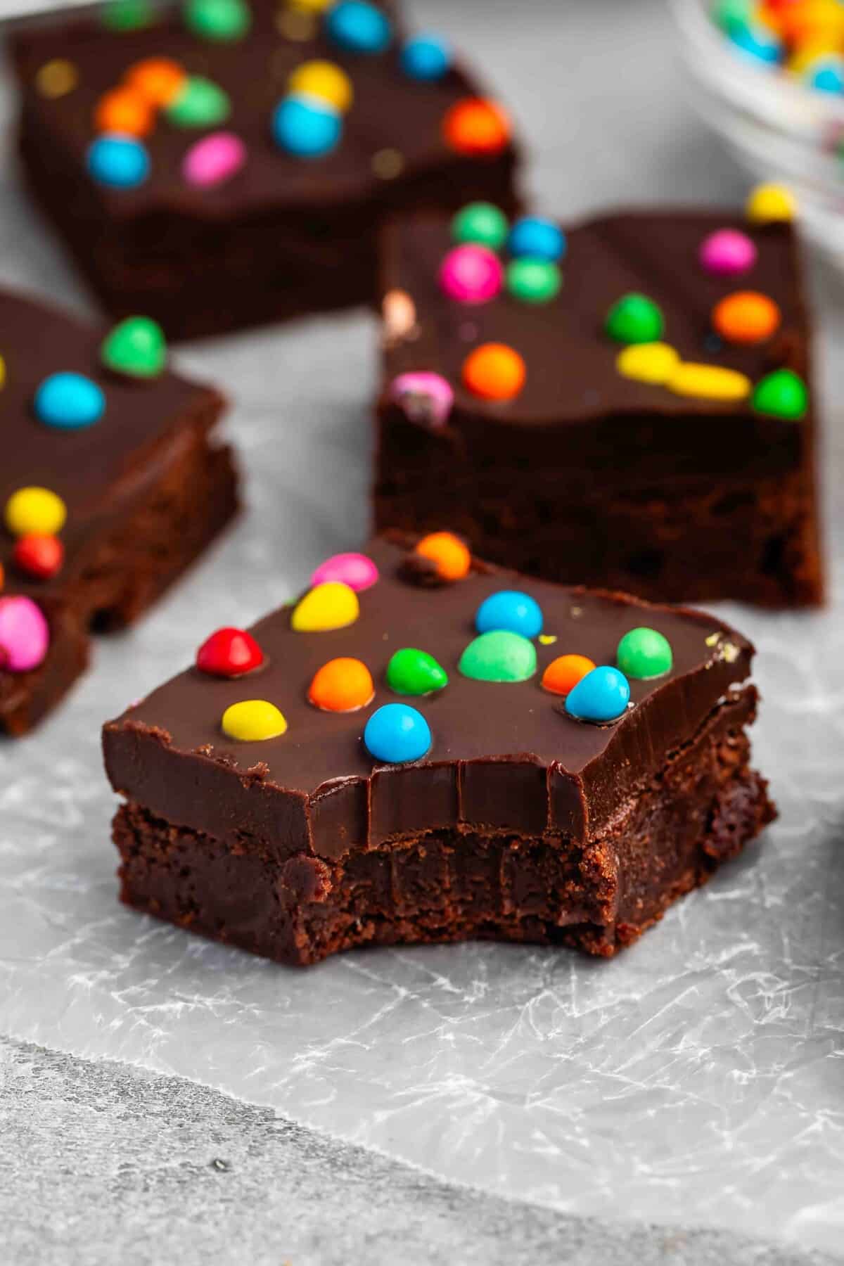 stacked chocolate brownies with colorful chocolate candy baked in.