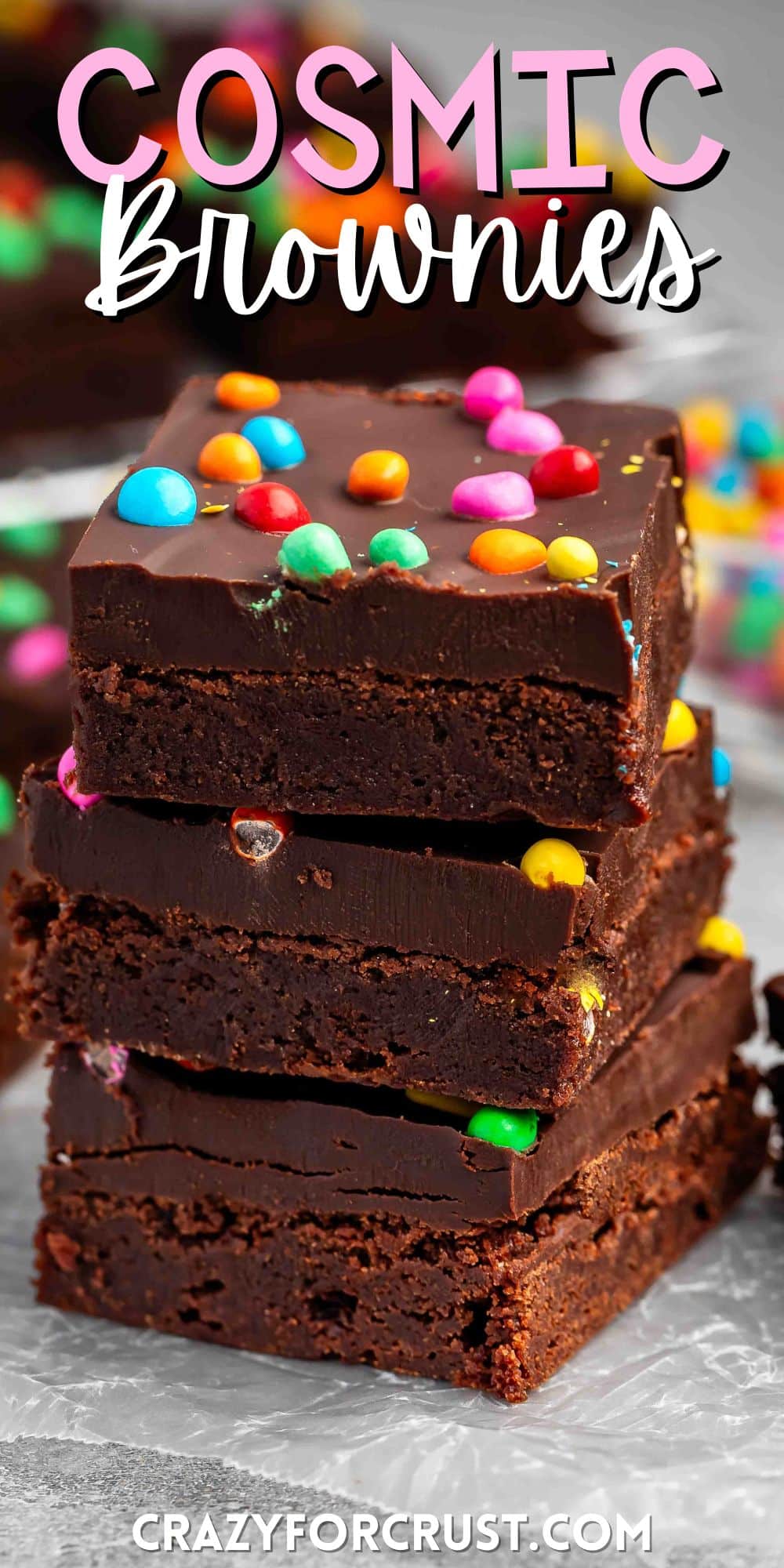 stacked chocolate brownies with colorful chocolate candy baked in with words on the image.