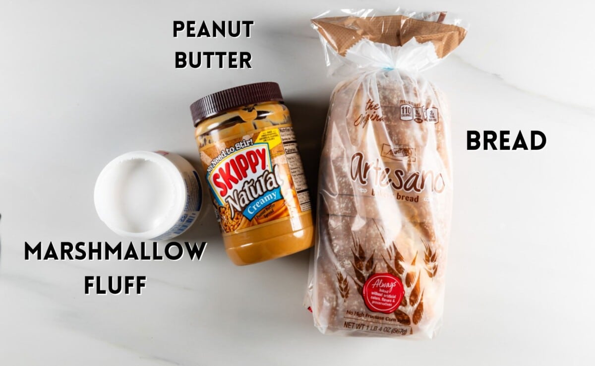 ingredients in fluffernutter sandwich laid out on a white marble counter.
