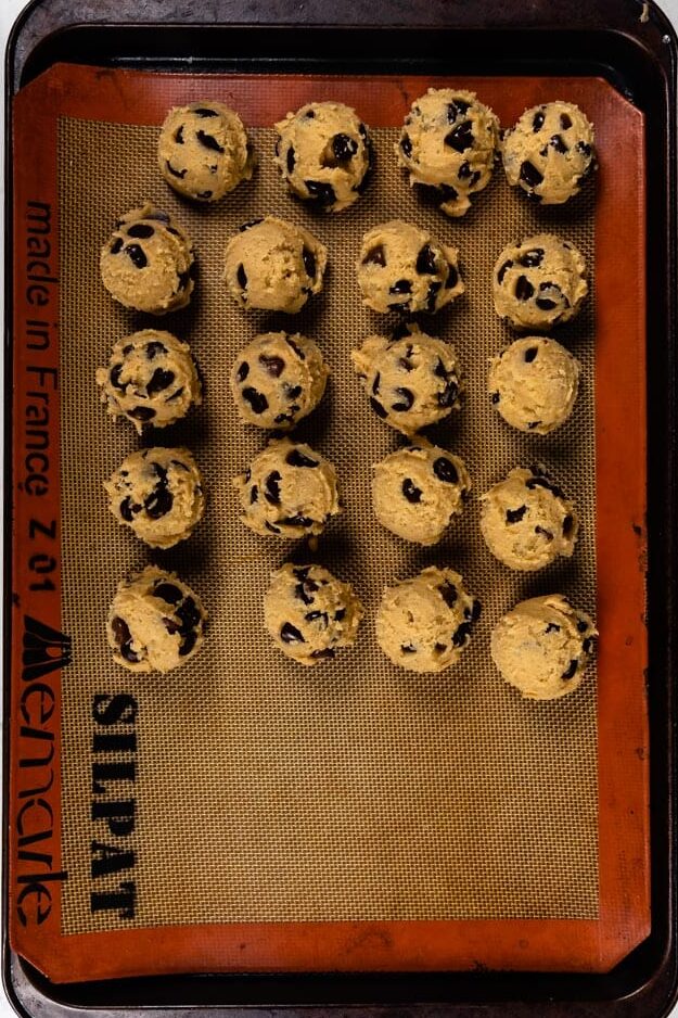 cookie dough balls on cookie sheet.